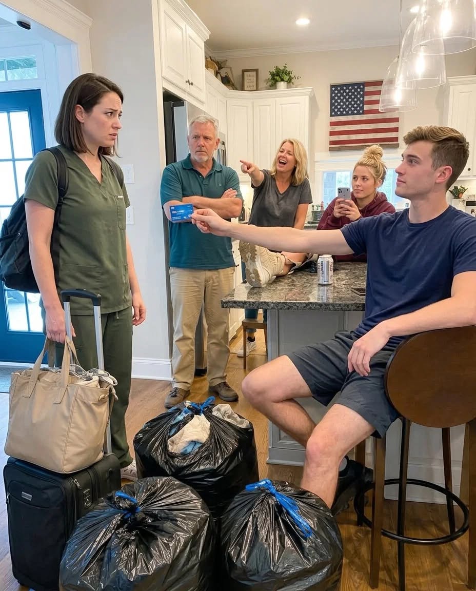My brother pushed my own ATM card across the kitchen table as if he had done me some kind of favor. He had drained ,000 from my account, moved his girlfriend into my bedroom, and sent me out into the freezing rain with my life stuffed into black trash bags. My parents laughed and said I “owed them rent anyway.” But what they did not realize was that the account they had touched had never been just mine.  I came home that Thursday night still in my navy scrubs.  A fourteen-hour shift in the NICU can take everything out of you. I had spent the day watching monitors, warming tiny blankets, and whispering to babies too small to know they were fighting to survive.  All I wanted was a shower.  Then I saw my suitcase sitting by the front door.  Next to it were three black contractor bags packed with my clothes, shoes, nursing books, and the small framed photo of my late Aunt Evelyn that usually stayed on my dresser.  The porch light was glowing.  Outside, the rain had already turned icy and sharp.  From the kitchen, laughter drifted toward me.  My brother Liam was leaning against the counter with his new girlfriend tucked under his arm. Brittany sat on the stool where I usually drank coffee before work, one of my blankets already folded beside her as if my room had belonged to her all along.  My mother did not look ashamed.  My father did not even get up.  “Why are my things packed?” I asked.  Liam smiled the way people smile when they know they have backup.  “Brittany’s moving in,” he said. “You’ve had that room long enough.”  I looked at my parents, waiting for one of them to admit this had gone too far.  Dad only took a slow sip of beer.  “Don’t start,” he said. “You’re a grown woman.”  Then Liam reached into his pocket and threw something onto the kitchen table.  My blue ATM card.  For a moment, I could only stare at it.  He said, “You can quit acting broke now.”  My hands went cold before I even opened my banking app.  The balance appeared.  Almost nothing left.  Forty-two thousand dollars gone.  Graduate school money.  Emergency money.  Years of overtime.  Years of skipped holidays.  Years of finishing night shifts only to run errands for a family that always needed “one more thing.”  I whispered, “That was my savings.”  Mom sighed as if I was the unreasonable one.  Dad said, “Consider it rent.”  Then Liam grabbed one of my bags and shoved it onto the porch.  “Your job here is done,” he said.  That was the sentence that finally stopped my tears.  Not because it hurt less.  Because in that moment, I understood he had finally said the truth out loud.  They thought they had emptied my account.  They thought they had removed me from that house.  They thought the bank would treat it like family drama instead of a crime.  But Aunt Evelyn had been careful.  Before she died, she had placed one condition around that money that none of them had bothered to understand.  By morning, the first call had already been made.  And when Liam discovered whose name was actually connected to that account, he was the first one who stopped laughing.  Full story in first comment 👇👇